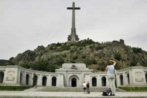 **  FILE  ** Spanish tourists are seen taking a snapshoot in this July 11, 2006 file photo in the Valle de Caidos (Valley of the Fallen), at the entrance of the basilica, carved into the rocks beneath a giant cross where the tomb of Spain's dictator General Francisco Franco lies. Parliament on Thursday began debating a law that seeks reparations for victims of the Spanish Civil war and the dictatorship of Gen. Francisco Franco. The bill, proposed by the Socialist government in July, would also ban symbols and references to the Franco regime in public buildings and asks local and regional governments to rename streets or plazas that are named after Franco or which refer to his regime. It also prohibits any political event at the Valley of the Fallen.(AP Photo/Bernat Armangue)